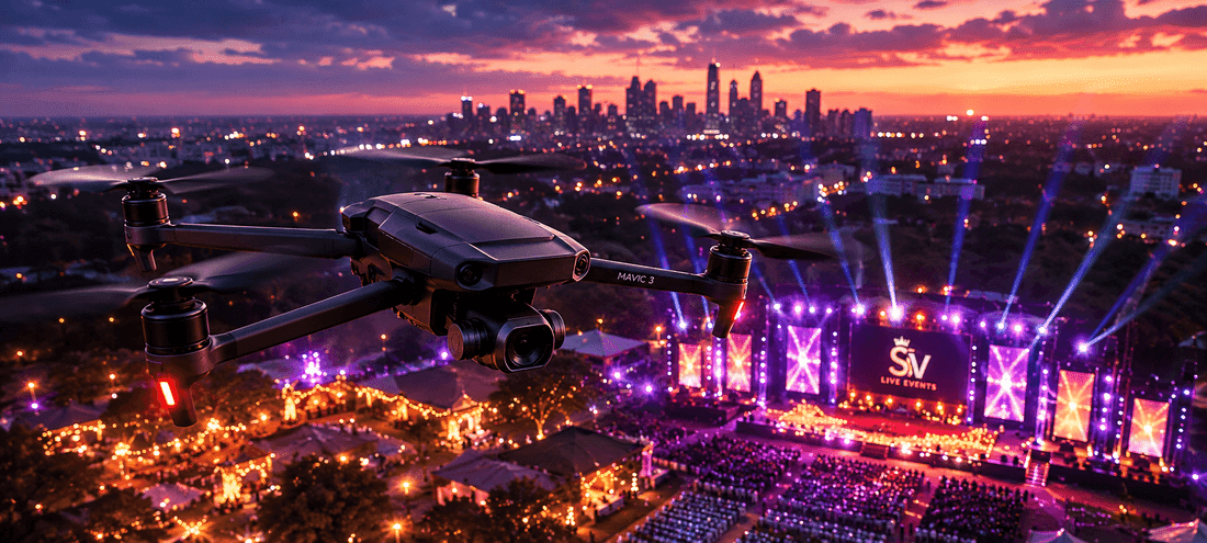 Drone flying above a lit outdoor stage